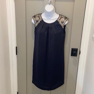 Tori Burch navy dress with metal appliqué details. Size 4.